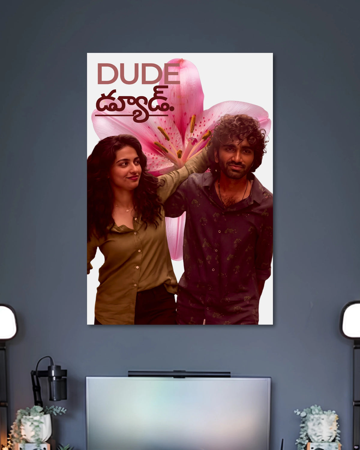 Dude Movie Poster Featuring Pradeep Ranganathan and Mamitha Baiju poster design: Pradeep Ranganathan and Mamitha Baiju appear against a large pink flower, with the Dude title displayed above them. The bold colours and romantic composition bring the film’s youthful energy to your walls.