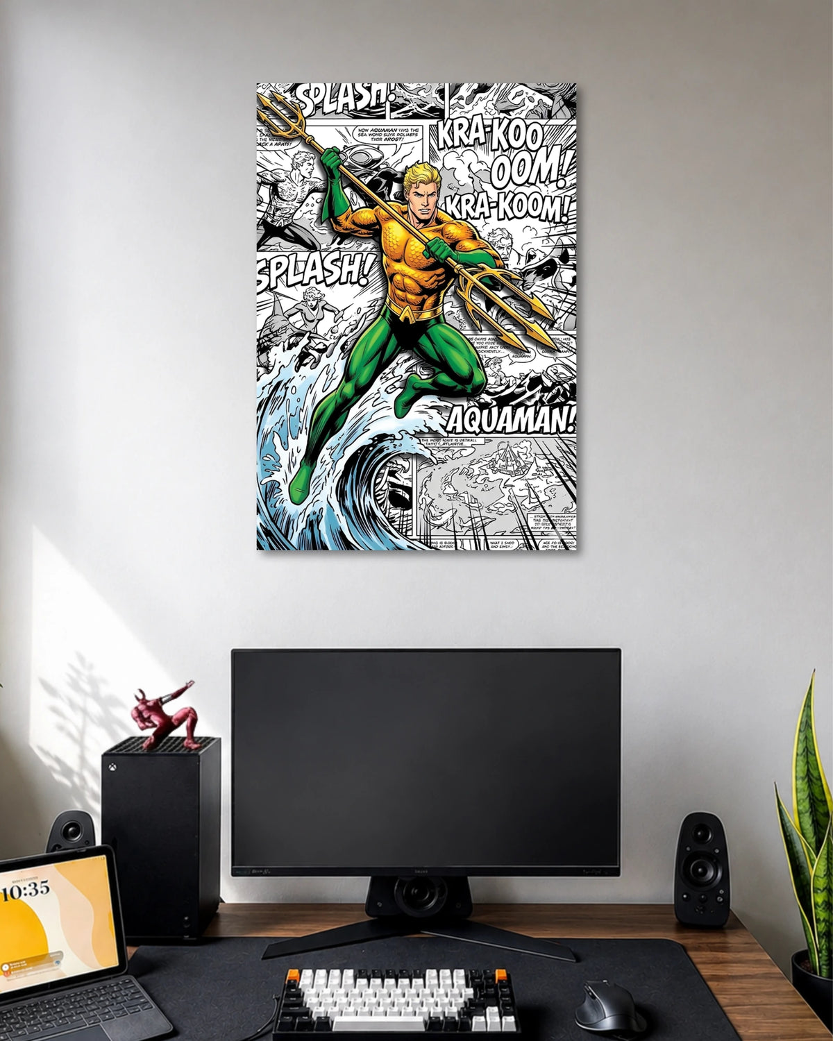 Aquaman in an orange top and green trousers holding a golden trident above a crashing wave with comic sound-effect lettering.