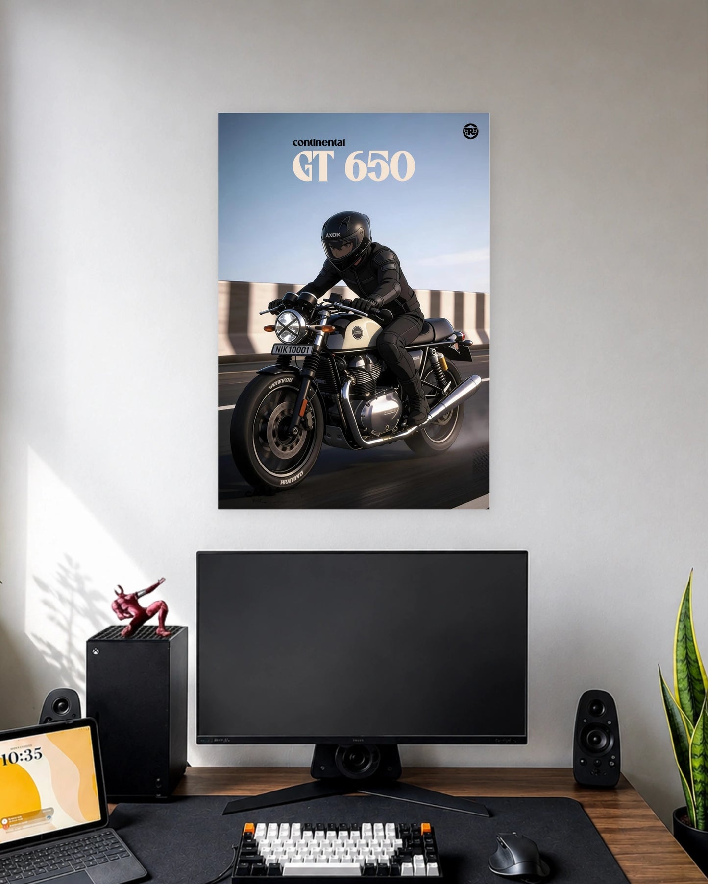 Royal Enfield Continental GT 650 Rider Poster wall poster displayed in a modern minimalist workspace setup 1