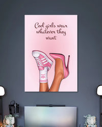Blush-pink poster with crossed illustrated legs in pink sneakers and high heels beneath Cool girls wear whatever they want text.