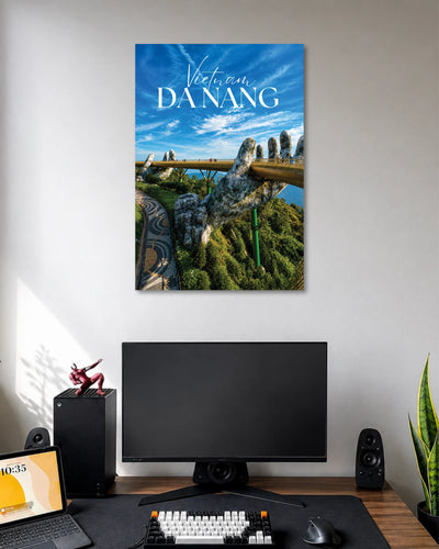 Da Nang Golden Bridge Poster poster design: Bring the iconic Golden Bridge of Da Nang into your space with this Vietnam travel poster. Giant stone hands support the golden walkway above lush green hills beneath a vivid blue sky. A great pick for travel lovers and modern room decor.