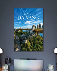 Da Nang Golden Bridge Poster poster design: Bring the iconic Golden Bridge of Da Nang into your space with this Vietnam travel poster. Giant stone hands support the golden walkway above lush green hills beneath a vivid blue sky. A great pick for travel lovers and modern room decor.