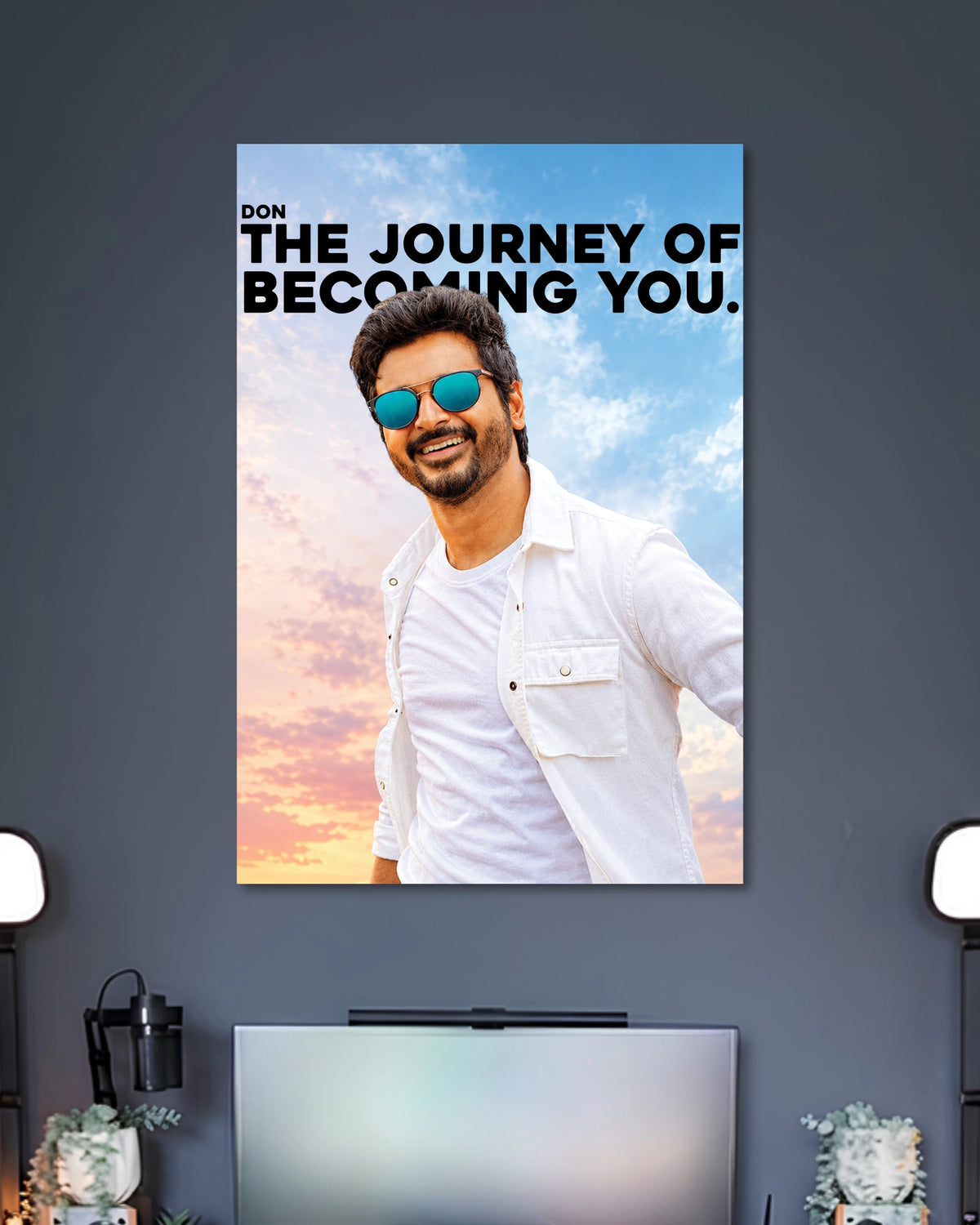 Don The Journey of Becoming You Sivakarthikeyan Poster poster design: Sivakarthikeyan appears in a white outfit and blue sunglasses against a pastel sky, alongside the bold quote “The Journey of Becoming You.” The design combines Tamil cinema style with an uplifting message for your walls.