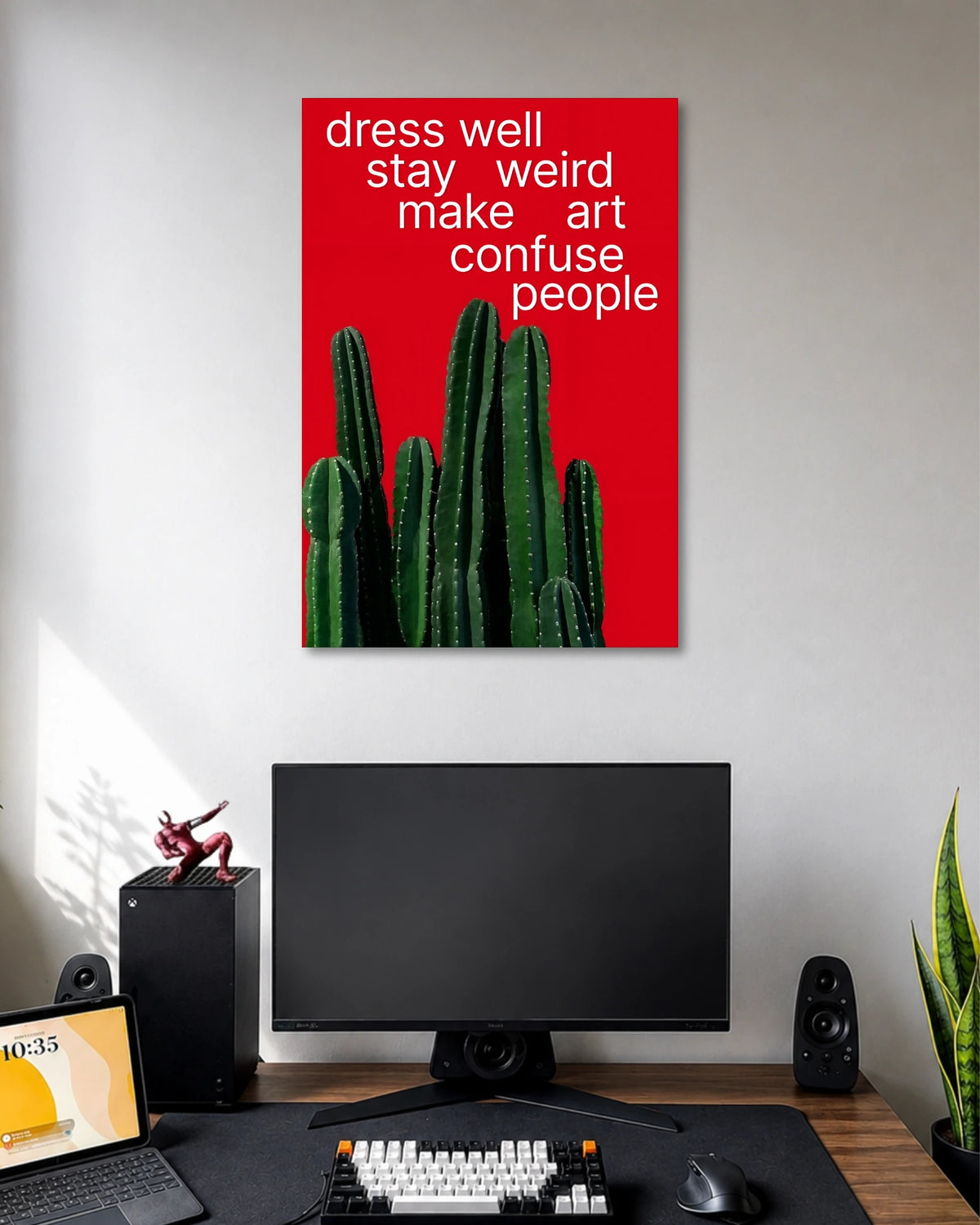 Dress Well Stay Weird Cactus Typography Poster poster design: A vibrant red poster featuring a cluster of green cacti and the playful phrase “Dress Well, Stay Weird, Make Art, Confuse People.” A fun statement piece for creative spaces.