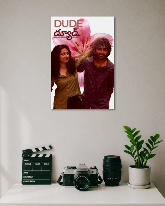 Dude Movie Poster Featuring Pradeep Ranganathan and Mamitha Baiju poster design: Pradeep Ranganathan and Mamitha Baiju appear against a large pink flower, with the Dude title displayed above them. The bold colours and romantic composition bring the film’s youthful energy to your walls.