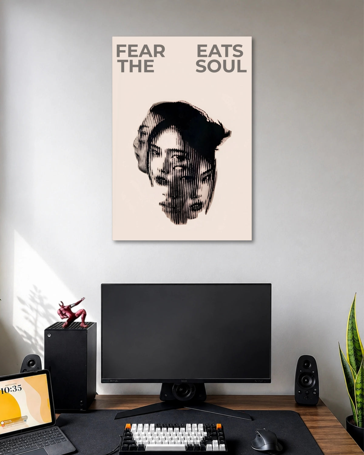 Beige poster with a fragmented black-and-white female portrait under the words FEAR EATS THE SOUL.