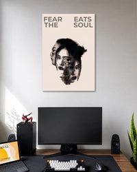 Beige poster with a fragmented black-and-white female portrait under the words FEAR EATS THE SOUL.