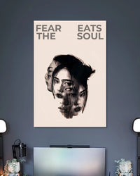 Beige poster with a fragmented black-and-white female portrait under the words FEAR EATS THE SOUL.