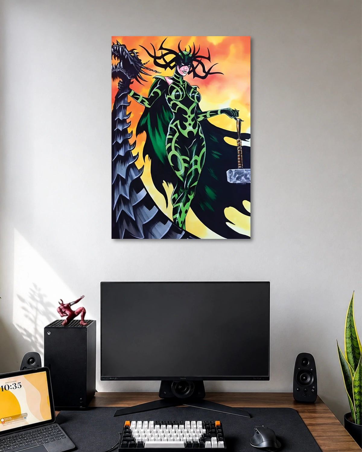 Illustrated Hela in black-and-green armor with a branching antler-like crown, holding a sword against orange skies.