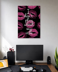 Black poster covered with magenta lipstick kiss marks and the white handwritten quote I don't play about my vibe.