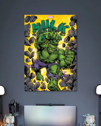 Comic illustration of the Hulk roaring and charging through shattered rocks on a bright yellow background.
