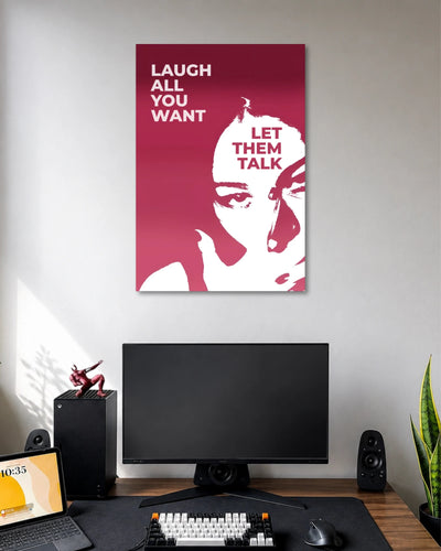 Burgundy graphic poster showing a white stylized woman's face with the words LAUGH ALL YOU WANT and LET THEM TALK.