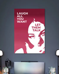 Burgundy graphic poster showing a white stylized woman's face with the words LAUGH ALL YOU WANT and LET THEM TALK.