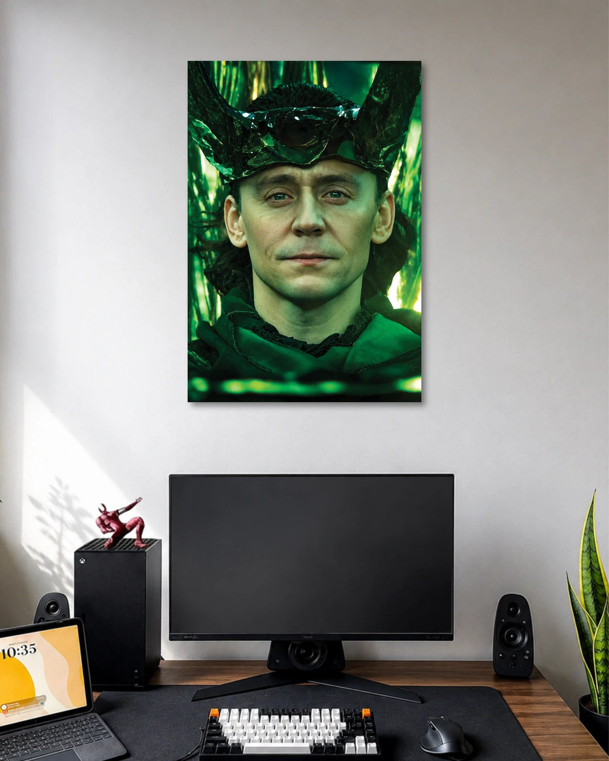 Loki Tom Hiddleston Marvel Poster poster design: Bring the God of Mischief to your wall with this Loki poster. Tom Hiddleston appears in a green tinted portrait wearing Loki's iconic horned headpiece, creating a bold look for Marvel fans and superhero themed rooms.