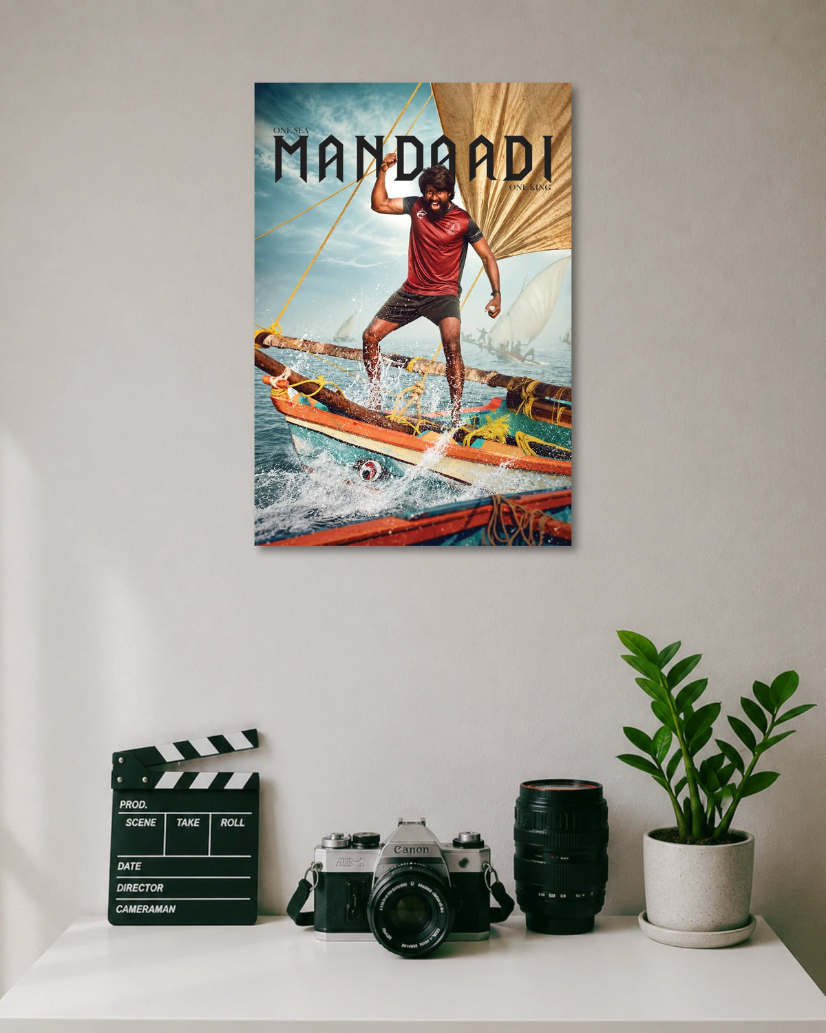 Mandadi Tamil Movie Poster poster design: A man stands on a traditional fishing boat surrounded by crashing ocean waves and sails in this Mandadi poster. The phrase “One Sea, One King” adds a bold finishing touch for fans of Tamil cinema.