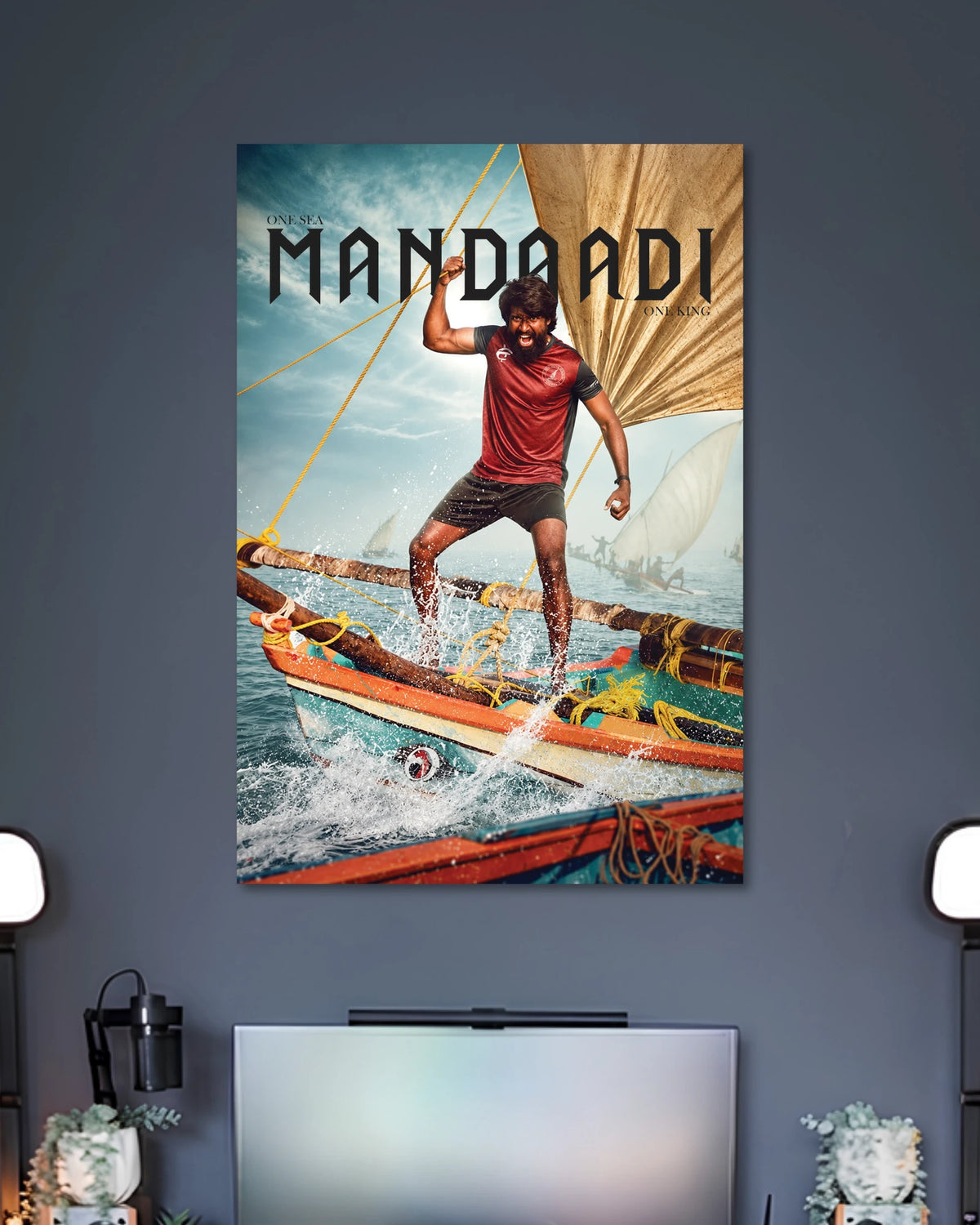 Mandadi Tamil Movie Poster poster design: A man stands on a traditional fishing boat surrounded by crashing ocean waves and sails in this Mandadi poster. The phrase “One Sea, One King” adds a bold finishing touch for fans of Tamil cinema.