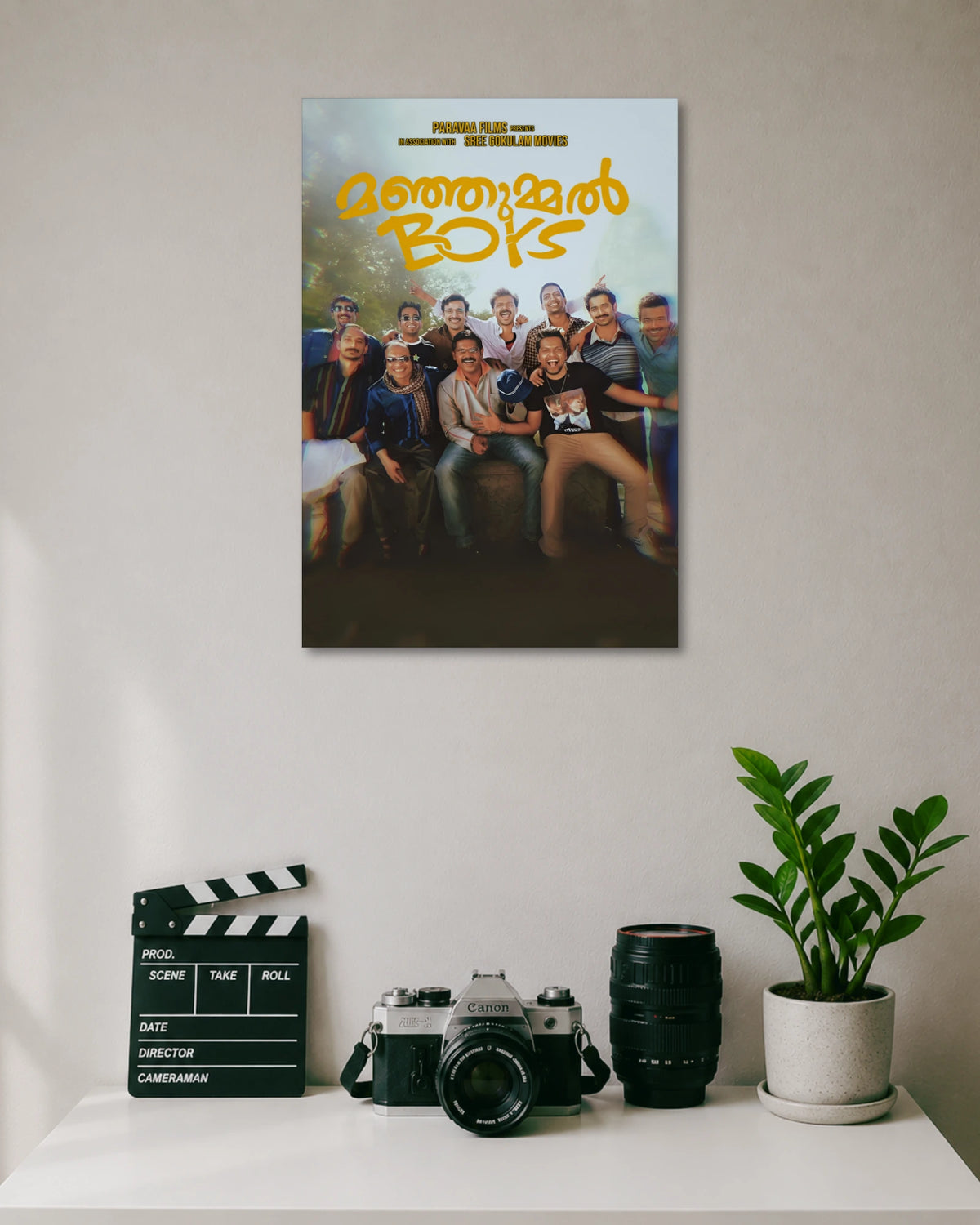 Manjummel Boys Movie Poster poster design: This Manjummel Boys poster brings the film's group of friends together in a cheerful ensemble portrait. The golden Malayalam title stands out against the soft natural background, while the darker lower section adds cinematic depth. A fitting choice for fans of the film.