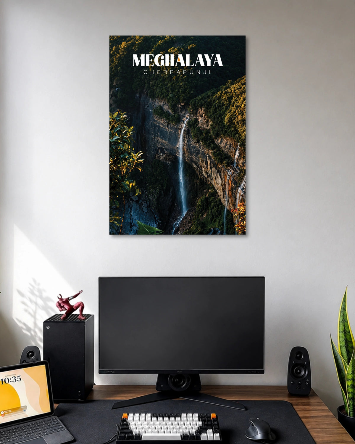 Meghalaya Cherrapunji Waterfall Poster poster design: This Meghalaya poster captures a slender waterfall descending between towering rocky cliffs and lush forest. Deep green foliage, rugged textures and the flowing white water create a dramatic natural landscape. The clean Cherrapunji typography completes this scenic design for travel and nature enthusiasts.