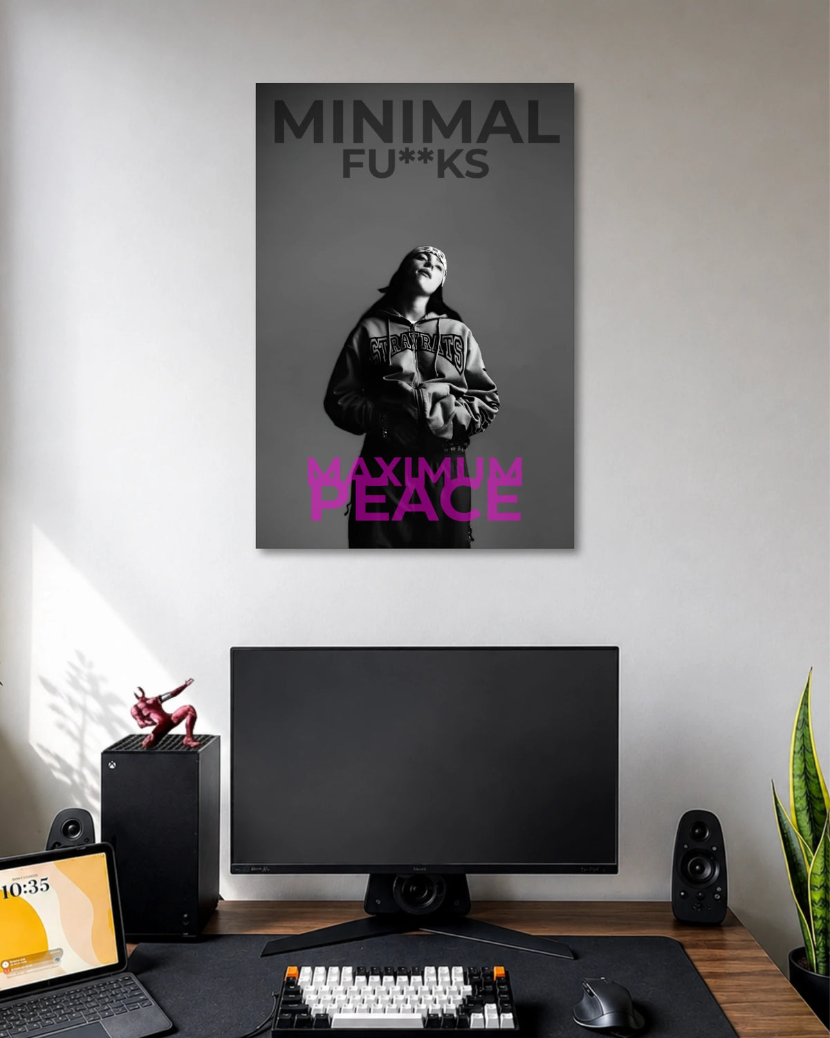 Grayscale portrait of a hooded woman with the words MINIMAL FU**KS at the top and MAXIMUM PEACE in pink at the bottom.
