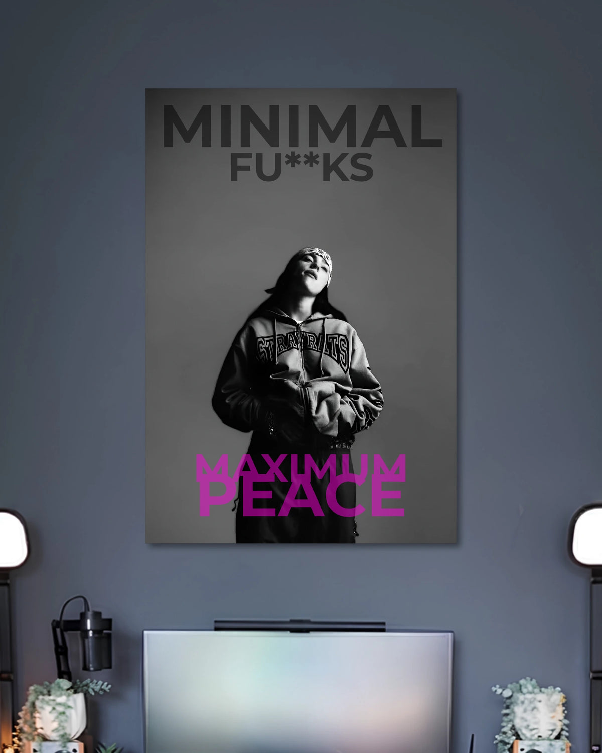 Grayscale portrait of a hooded woman with the words MINIMAL FU**KS at the top and MAXIMUM PEACE in pink at the bottom.