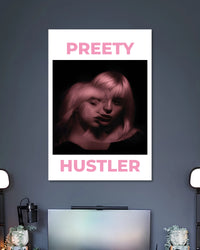 White poster with a dark close-up portrait of a woman tinted pink between PRETTY and HUSTLER lettering.