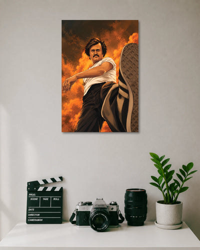 Rajinikanth Mass Action Movie Poster poster design: A striking illustrated portrait of Rajinikanth in a powerful action pose, with a dramatic orange and fiery background. The bold composition captures the superstar's iconic screen presence and makes a standout addition to any Tamil cinema fan's collection.
