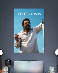 Sanjay Dutt The Jinn Poster poster design: Bring the intense presence of Sanjay Dutt as The Jinn from Dhurandhar to your walls. Set against a clear blue sky, the poster features his bearded look, aviator sunglasses and white outfit for a bold cinematic display.