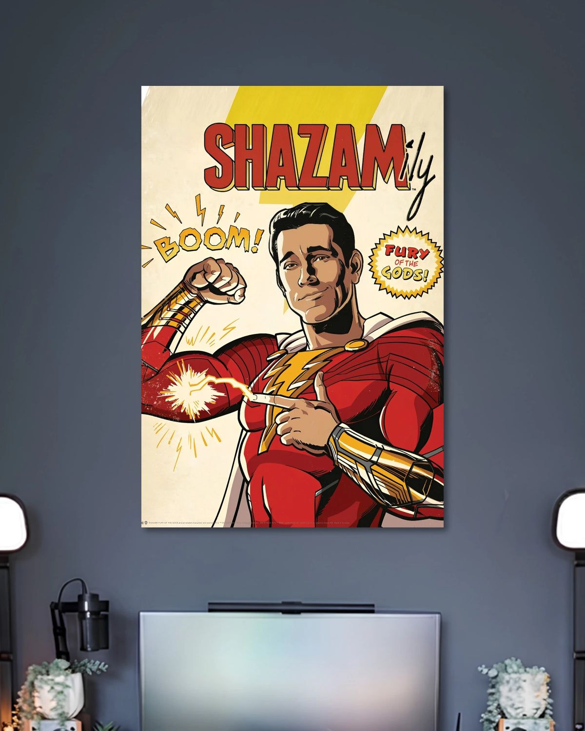 Retro comic illustration of Shazam smiling in his red-and-gold suit under SHAZAM lettering with BOOM sound effects.