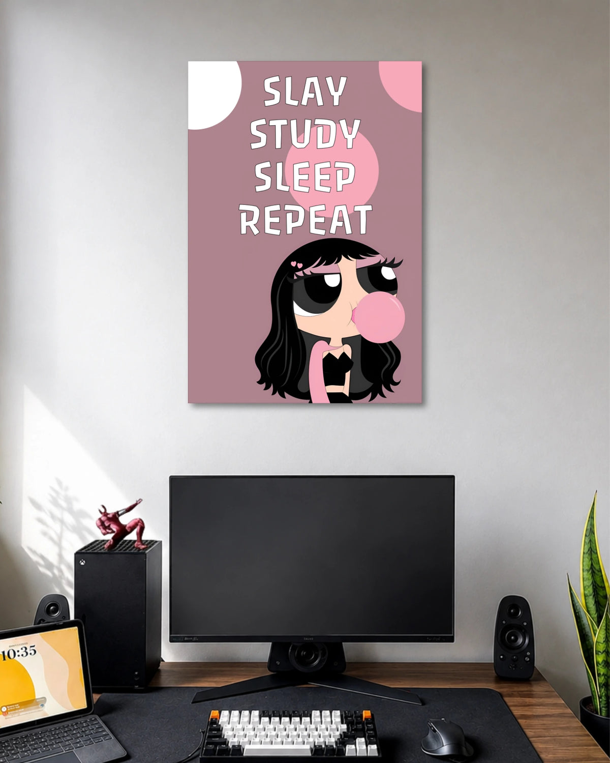 Mauve-pink poster with SLAY STUDY SLEEP REPEAT lettering above a black-haired cartoon girl blowing pink bubblegum.