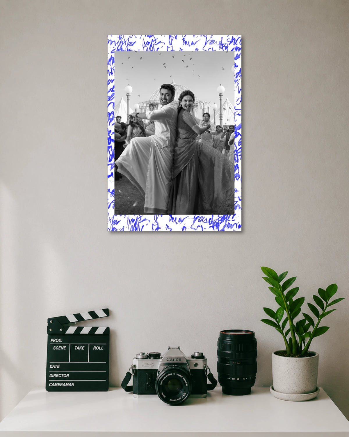 Suriya Mamitha Baiju Vishwanath Sons Poster poster design: Celebrate the pairing of Suriya and Mamitha Baiju with this Vishwanath & Sons poster. The black and white design captures the couple dancing in traditional outfits, with blue handwritten details adding a distinctive finish.