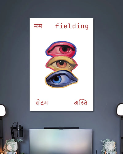 Three Eyes Fielding Typography Art Poster poster design: Three illustrated eyes in red, yellow, and blue are stacked vertically against a clean white background. Hindi lettering and the English word “fielding” frame the artwork, creating an unusual graphic design with a playful, contemporary feel.
