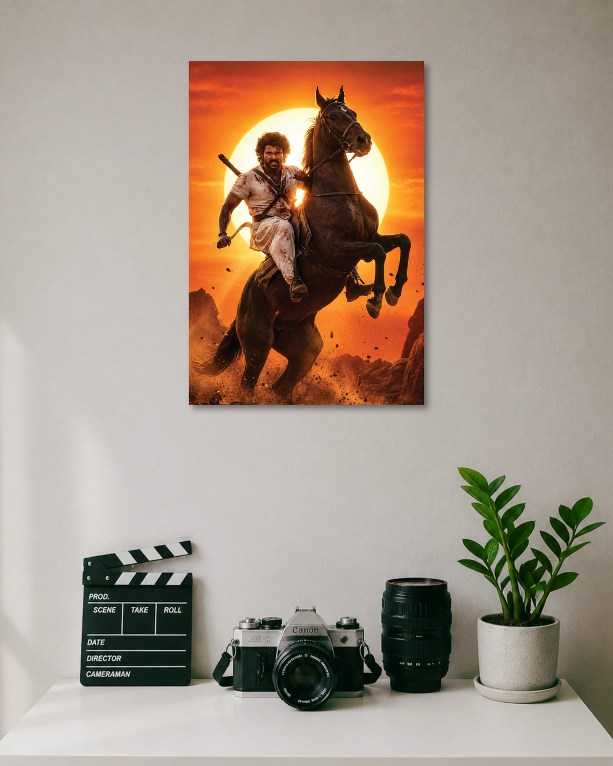 Vijay Deverakonda Ranabaali Poster poster design: Vijay Deverakonda appears as a rugged warrior riding a rearing horse against a blazing orange sunset in this Ranabaali poster. The dramatic pose and period inspired look create a powerful design for fans of Telugu cinema.
