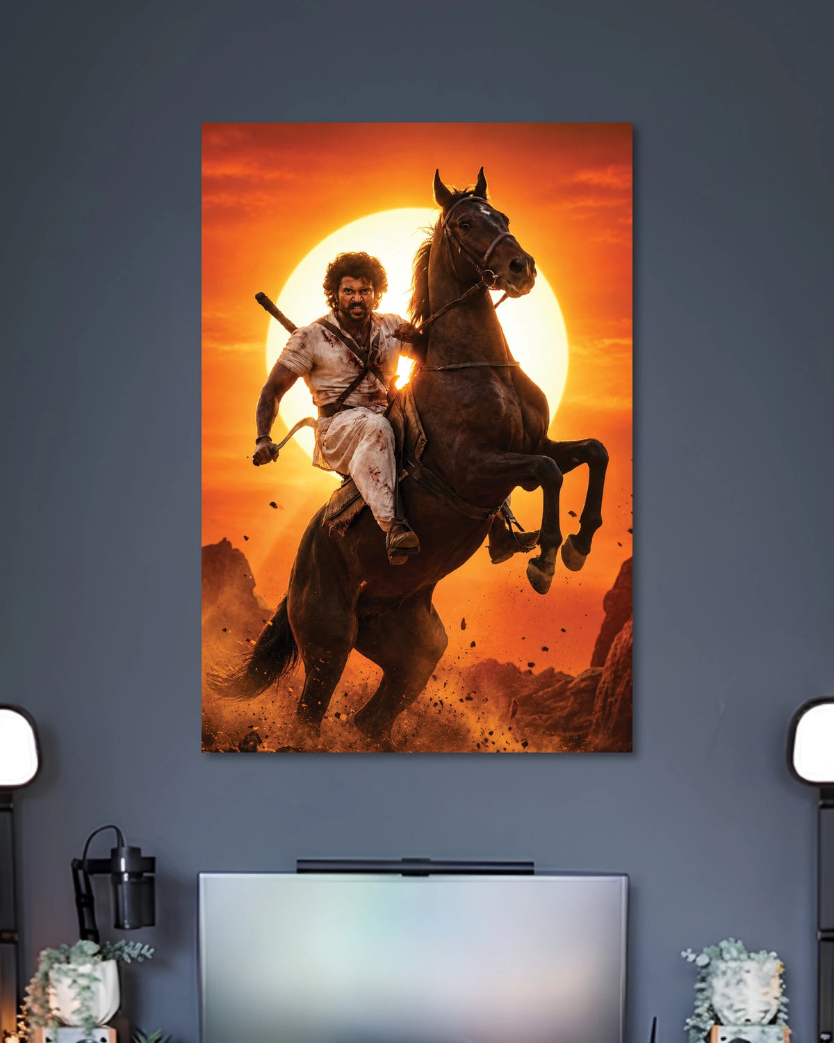 Vijay Deverakonda Ranabaali Poster poster design: Vijay Deverakonda appears as a rugged warrior riding a rearing horse against a blazing orange sunset in this Ranabaali poster. The dramatic pose and period inspired look create a powerful design for fans of Telugu cinema.