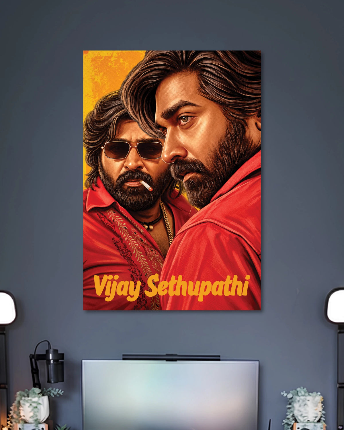 Vijay Sethupathi Illustrated Portrait Poster poster design: Vijay Sethupathi appears in a detailed illustrated portrait wearing a red shirt, with another portrait of the actor in sunglasses behind him. Rich red and golden tones give the artwork a bold, cinematic look for fans.
