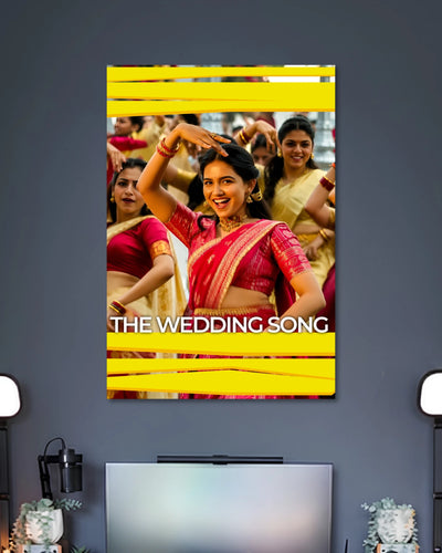 Vishwanathan and Sons Wedding Song Poster poster design: This Vishwanathan and Sons poster captures a vibrant wedding dance scene, with a woman in a pink saree at the centre and other dancers in traditional attire behind her. Bright yellow graphic bands and clean white lettering add a lively cinematic finish.